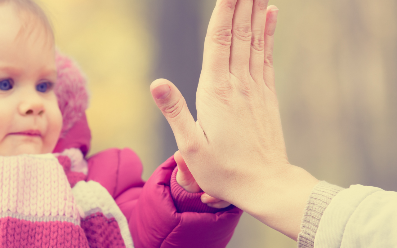 safety, mum and baby high five